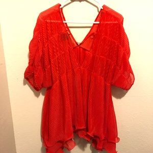 Bright red ruffle blouse.